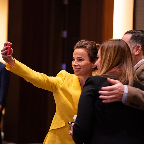 A group of Pavilion members taking a selfie at a conference.