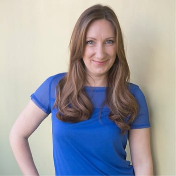 A photo of Jenn Deering Davis wearing a blue short sleeved shirt.