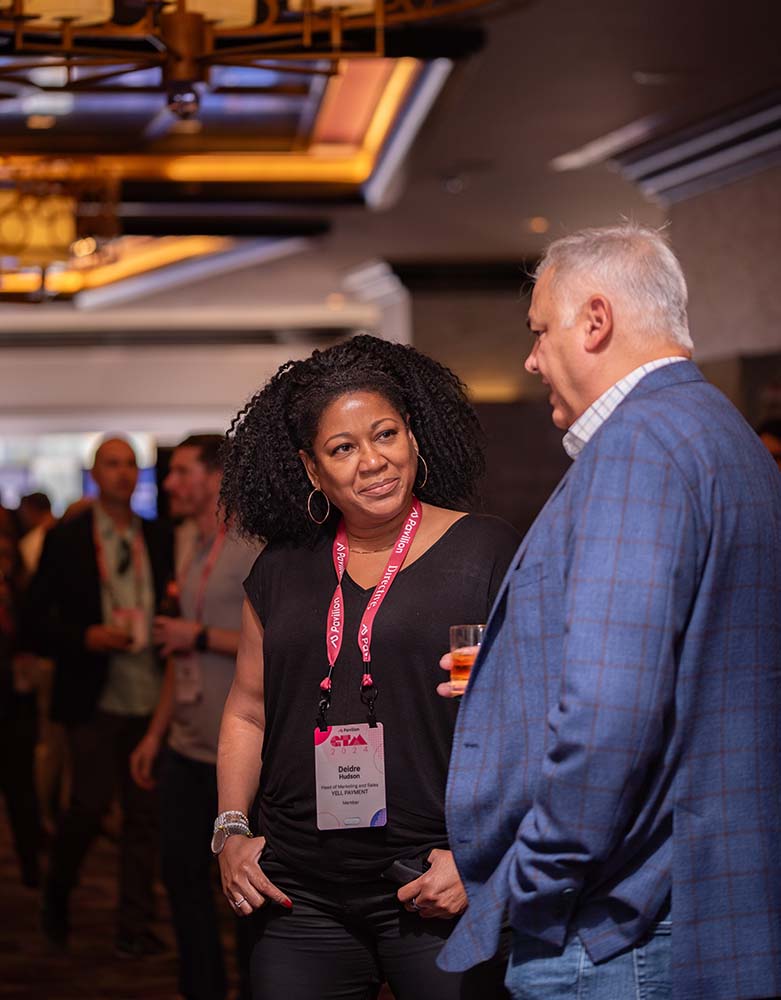 Two GTM attendees connecting in the exhibition hall